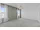 Bedroom with two large windows offering plenty of natural light and plush carpeting at 76 Arlie Ln, Lillington, NC 27546