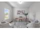 A serene home office space with a contemporary desk, modern decor, and ample natural light at 76 Arlie Ln, Lillington, NC 27546