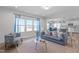 Open-concept living room with a modern design, fireplace, and comfortable seating area at 76 Arlie Ln, Lillington, NC 27546