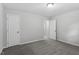 Neutral bedroom featuring plush carpet, a closet, and a doorway leading into another room at 804 Harper Rd, Hillsborough, NC 27278