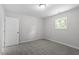 Neutral bedroom featuring plush carpet, a window, and a closet for ample storage at 804 Harper Rd, Hillsborough, NC 27278
