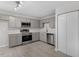 Contemporary kitchen with gray cabinets, stainless steel appliances, and sleek countertops at 804 Harper Rd, Hillsborough, NC 27278