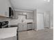Stylish kitchen featuring gray cabinetry and stainless steel appliances at 804 Harper Rd, Hillsborough, NC 27278