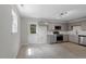 Modern kitchen with gray cabinets, stainless appliances, and mosaic backsplash at 804 Harper Rd, Hillsborough, NC 27278