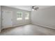 Bright living area with a ceiling fan and a white front door at 804 Harper Rd, Hillsborough, NC 27278