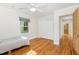 This bedroom has hard wood floors, a ceiling fan, lots of light and large closet at 804 Old Mill Rd, Chapel Hill, NC 27514