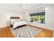 Spacious main bedroom features hardwood floors, recessed lighting, ceiling fan and a window seat at 804 Old Mill Rd, Chapel Hill, NC 27514