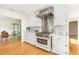 Gourmet kitchen features stainless steel appliances, custom cabinetry, and a seamless transition to the breakfast area at 804 Old Mill Rd, Chapel Hill, NC 27514