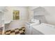 Bright laundry room with washer, dryer, checkered floors and ample shelving space at 804 Old Mill Rd, Chapel Hill, NC 27514