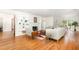 Open-concept living room boasts hardwood floors, built-in shelving, a fireplace, and lots of natural light at 804 Old Mill Rd, Chapel Hill, NC 27514