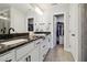 This bathroom has double sinks, granite countertops, and a large walk in closet at 805 Winter Meadow Dr, Wake Forest, NC 27587