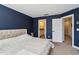 Cozy bedroom features an ensuite bathroom and is decorated with dark blue walls at 805 Winter Meadow Dr, Wake Forest, NC 27587