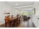 Open-concept living: Dining area flows into a sunny living room, perfect for entertaining and easy living at 805 Winter Meadow Dr, Wake Forest, NC 27587