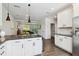 Open kitchen design with granite counters and stainless appliances overlooking the living area, ideal for entertaining at 805 Winter Meadow Dr, Wake Forest, NC 27587