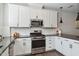 Well-equipped kitchen with sleek countertops, ample cabinet space, and stainless steel appliances for modern convenience at 805 Winter Meadow Dr, Wake Forest, NC 27587