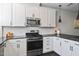 Bright and modern kitchen featuring stainless steel appliances, granite countertops and ample cabinet space at 805 Winter Meadow Dr, Wake Forest, NC 27587