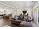 Inviting living space with a sectional sofa flowing into the dining room and kitchen, perfect for modern living at 805 Winter Meadow Dr, Wake Forest, NC 27587