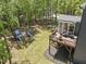 Overhead shot of the backyard with a well-appointed deck and shaded playground at 8237 Baronleigh Ln, Wake Forest, NC 27587