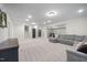 Large finished basement with plush carpeting and a comfortable seating area, perfect for entertaining at 8237 Baronleigh Ln, Wake Forest, NC 27587