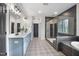 Modern bathroom featuring double sinks, stylish tile flooring, and a glass-enclosed shower at 8237 Baronleigh Ln, Wake Forest, NC 27587