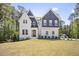 Beautiful two-story home with a brick and siding exterior, landscaped yard, and welcoming front porch at 8237 Baronleigh Ln, Wake Forest, NC 27587