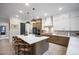 Spacious kitchen with a large center island, modern appliances, and pendant lighting at 8237 Baronleigh Ln, Wake Forest, NC 27587