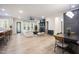 Spacious living room with a fireplace, modern furniture, hardwood floors and a ceiling fan at 8237 Baronleigh Ln, Wake Forest, NC 27587