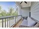 Relaxing balcony with wicker furniture. Enjoy outdoor relaxation and the tree views! at 8426 Garnet Rose Ln, Raleigh, NC 27615