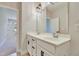 Elegant bathroom with double vanity, white cabinets, and sleek black hardware at 8426 Garnet Rose Ln, Raleigh, NC 27615