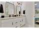 Elegant bathroom with dual sinks, granite countertops, and modern lighting at 8426 Garnet Rose Ln, Raleigh, NC 27615