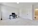 Spacious bedroom with neutral carpet, a modern desk, and ample natural light at 8426 Garnet Rose Ln, Raleigh, NC 27615