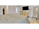 Comfortable bedroom with bed, dresser, and a full-length mirror at 8426 Garnet Rose Ln, Raleigh, NC 27615