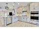 Stylish kitchen with stainless steel appliances, gray cabinets, and an open layout at 8426 Garnet Rose Ln, Raleigh, NC 27615