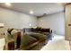 Living room with a velvet couch and comfortable seating. Ideal for relaxing and entertaining at 8426 Garnet Rose Ln, Raleigh, NC 27615