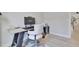 Bright office space with wood floors, light walls, and a stylish desk setup at 8426 Garnet Rose Ln, Raleigh, NC 27615