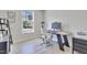 Bright home office with modern desk, chair, and ample natural light at 8426 Garnet Rose Ln, Raleigh, NC 27615