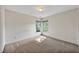 Neutral carpeted bedroom featuring a double window, providing ample natural light at 8629 Swarthmore Dr, Raleigh, NC 27615