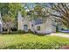 Charming home featuring a well-manicured lawn and inviting curb appeal, with mature trees at 8629 Swarthmore Dr, Raleigh, NC 27615