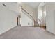 Open living space with staircase, neutral carpeting, and natural light pouring in at 8629 Swarthmore Dr, Raleigh, NC 27615