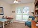 Bright bedroom featuring a window view, a chair, and a quilt on the table at 8712 Attingham Dr, Raleigh, NC 27615