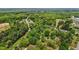 Overhead view of home site with surrounding trees and neighborhood at 901D Gibson Rd, Mebane, NC 27302