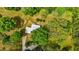 Aerial view of home with metal roof and mature landscaping at 901D Gibson Rd, Mebane, NC 27302