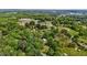 Overhead view of a home nestled within a wooded area on a generous lot at 901D Gibson Rd, Mebane, NC 27302