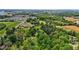 Panoramic aerial shot featuring the property with mature trees and a barn at 901D Gibson Rd, Mebane, NC 27302