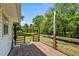 Spacious wooden deck with railing overlooking lush green yard and wooded area at 901D Gibson Rd, Mebane, NC 27302