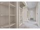 Hallway with built-in shelving, light walls, and carpet at 901D Gibson Rd, Mebane, NC 27302