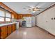 Bright kitchen with stainless steel appliances, wooden cabinets and adjacent breakfast area at 901D Gibson Rd, Mebane, NC 27302