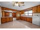 Spacious kitchen area leading to a living space, complete with wooden cabinetry and modern appliances at 901D Gibson Rd, Mebane, NC 27302