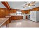 Well-lit kitchen with wooden cabinetry, classic countertops, and modern appliances at 901D Gibson Rd, Mebane, NC 27302