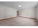 A blank canvas in this living room features neutral carpet and trim at 901D Gibson Rd, Mebane, NC 27302